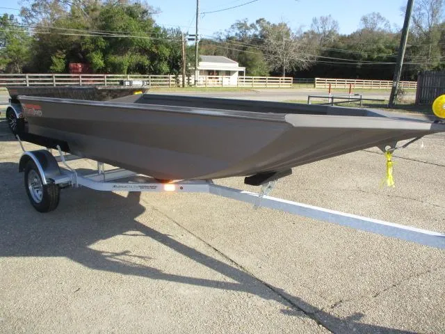 Slide: The Image of 2025 Reaper Boats 553-1238 on trailer, parked outdoors. - 1