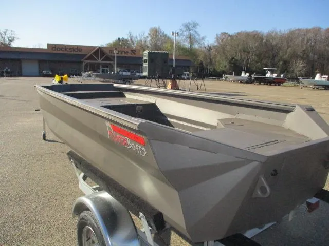 Slide: The Image of 2025 Reaper Boats 553-1238 model on trailer at dockside. - 3