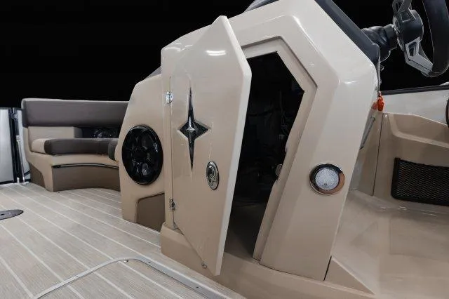 Slide: The Image of 2024 Berkshire 23ULSTS3-93 boat interior with open storage compartment and seating. - 10