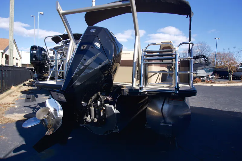 Slide: The Image of 2024 Berkshire 23ULSTS3-93 pontoon boat with powerful outboard motor. - 2