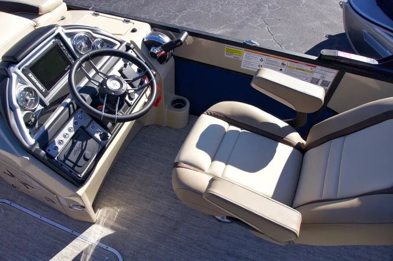 Slide: The Image of 2024 Berkshire 23ULSTS3-93 boat interior with steering console and captain's chair. - 5