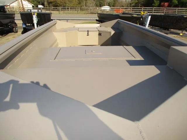 Slide: The Image of Reaper Boats 550-1240, 2025 model, beige interior, docked outdoors. - 3