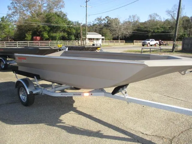 Slide: The Image of 2025 Reaper Boats 550-1240 on trailer in sunny outdoor setting. - 4