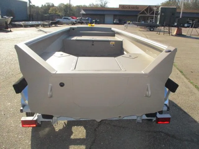 Slide: The Image of 2025 Reaper Boats 550-1240 model, rear view, parked on a trailer at a dockside location. - 5