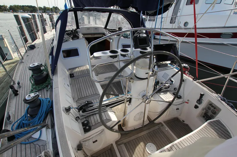Slide: The Image of Cockpit of 2001 Nautor Swan 44MKII sailboat with steering wheel and navigation equipment. - 12