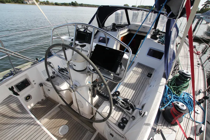 Slide: The Image of Cockpit of 2001 Nautor Swan 44MKII sailboat with steering wheel and navigation equipment. - 13