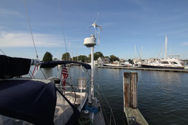 Slide: The Image of Nautor Swan 44MKII sailboat docked at marina, clear sky, calm water, 2001 model. - 15