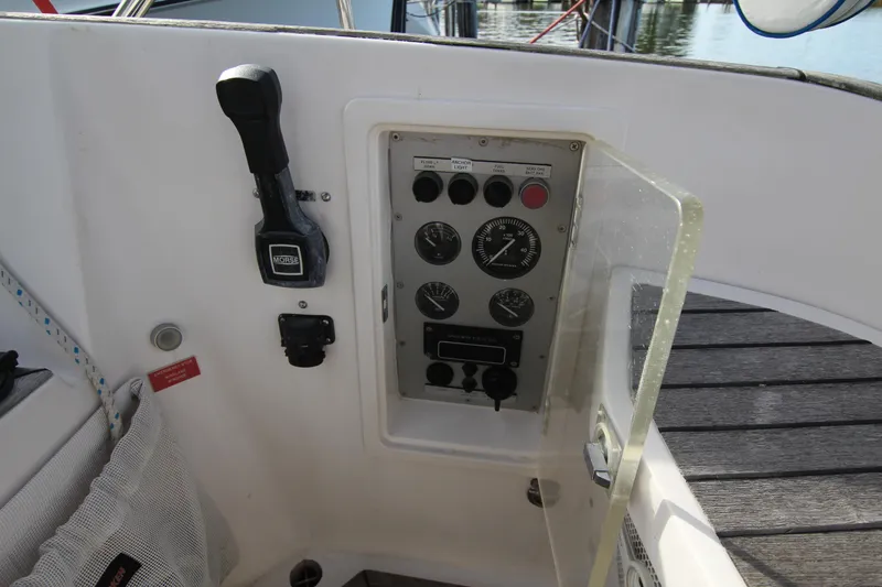 Slide: The Image of Control panel of a 2001 Nautor Swan 44MKII yacht, featuring gauges and switches. - 16