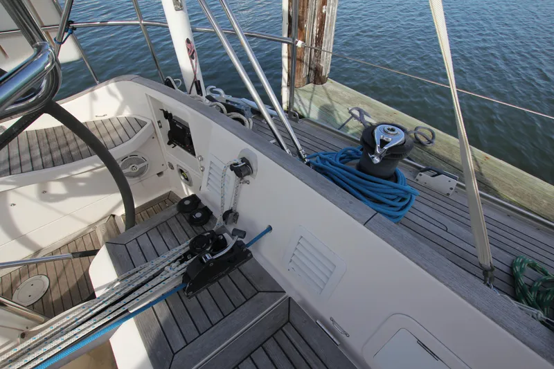Slide: The Image of Cockpit of 2001 Nautor Swan 44MKII yacht with ropes and winch by the water. - 20