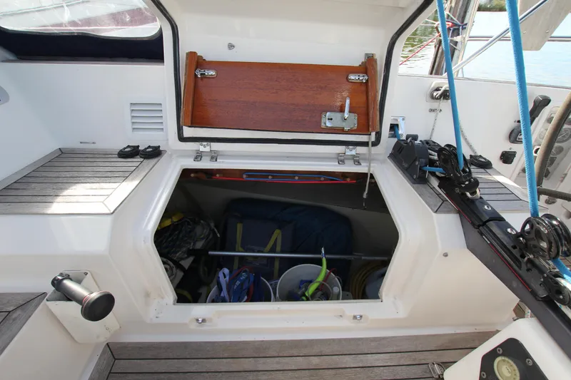 Slide: The Image of Storage compartment on a 2001 Nautor Swan 44MKII sailboat, featuring organized sailing gear. - 22