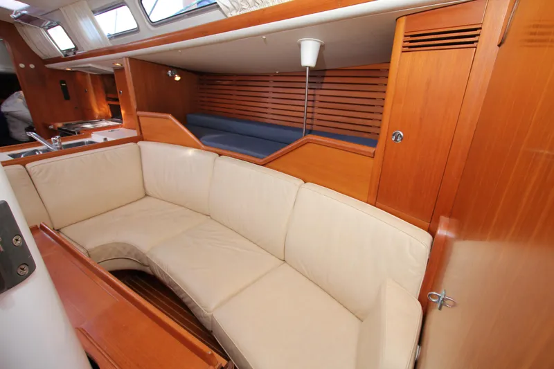 Slide: The Image of Interior of 2001 Nautor Swan 44MKII yacht with beige seating and wooden finishes. - 31