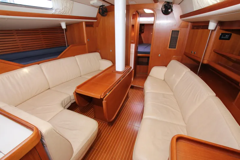 Slide: The Image of Luxurious interior of 2001 Nautor Swan 44MKII yacht with elegant wood finish and plush seating. - 32