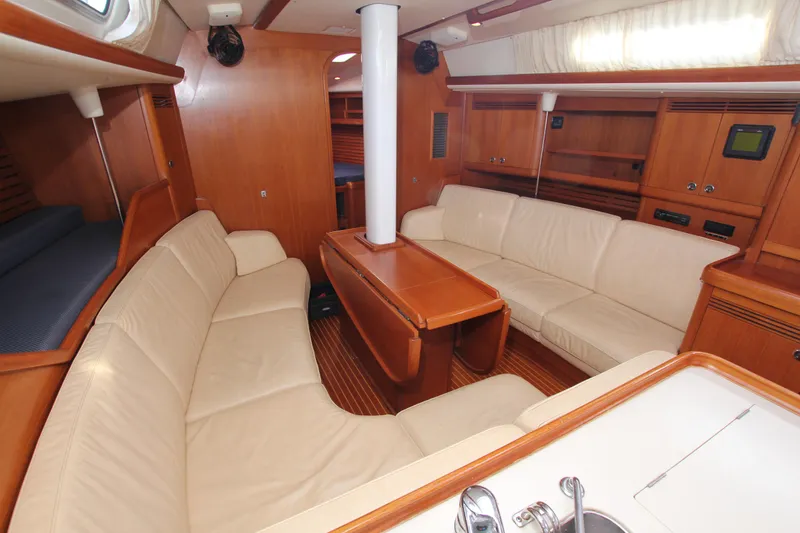 Slide: The Image of Luxurious interior of 2001 Nautor Swan 44MKII yacht with elegant wood finish and plush seating. - 33