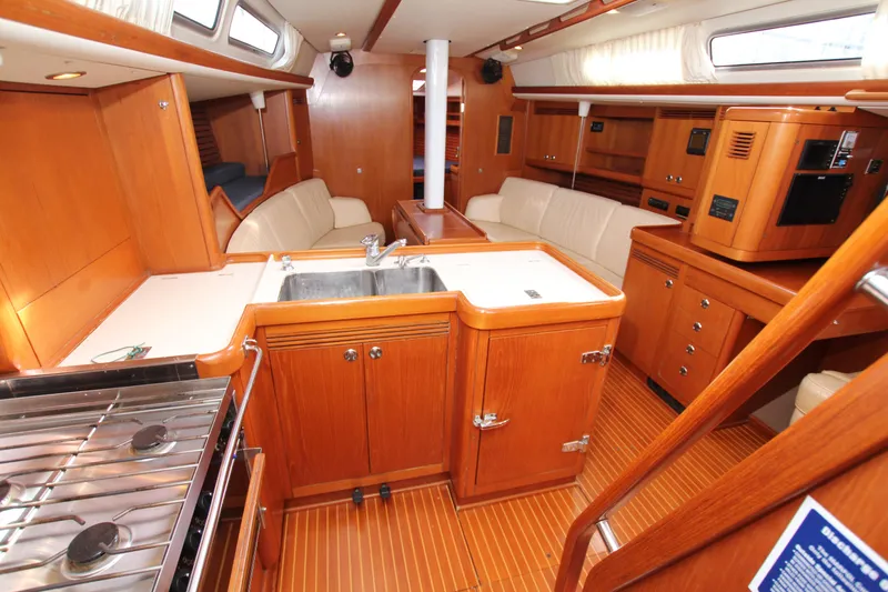 Slide: The Image of Interior of 2001 Nautor Swan 44MKII yacht with wooden cabinetry and modern amenities. - 34