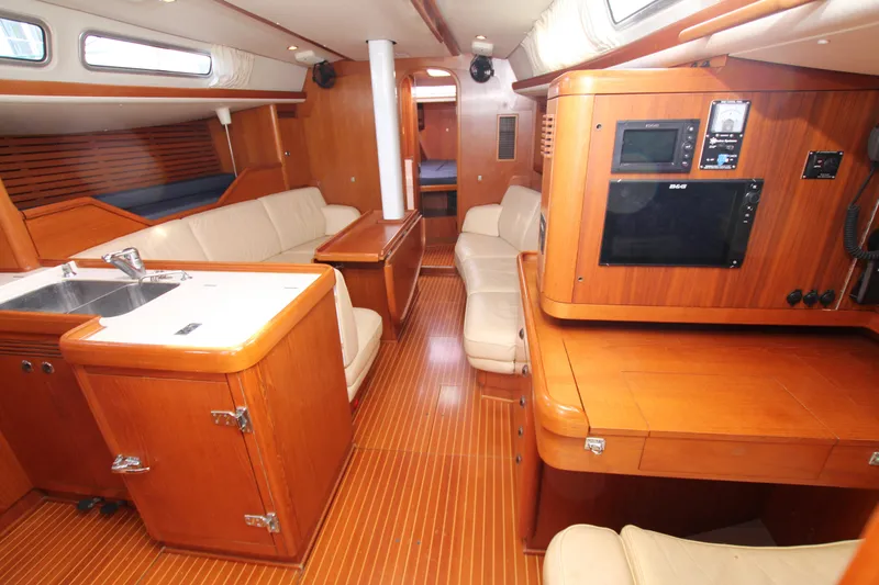 Slide: The Image of Luxurious interior of 2001 Nautor Swan 44MKII yacht with wood finish and seating area. - 36
