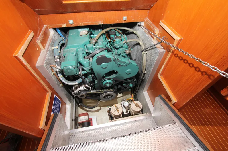Slide: The Image of Engine compartment of 2001 Nautor Swan 44MKII sailboat, showcasing a well-maintained marine engine. - 42