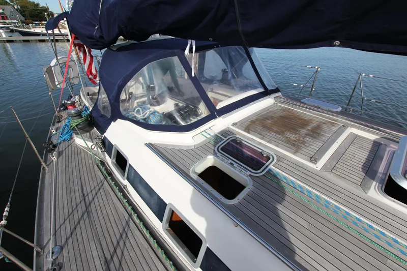 Slide: The Image of Nautor Swan 44MKII sailboat deck, 2001 model, featuring sleek design and spacious cockpit. - 9