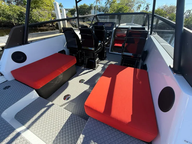 Slide: The Image of 2024 Goldfish 46 Open boat interior with red seating and modern design. - 12