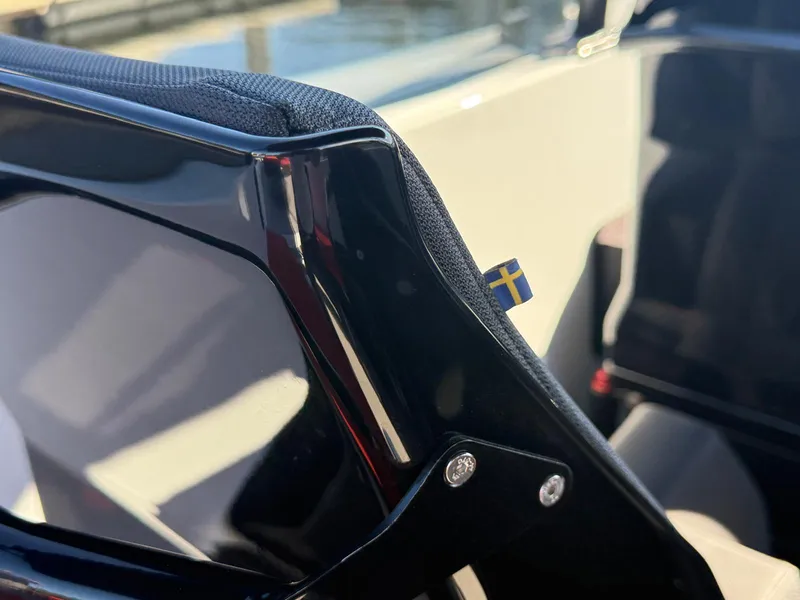 Slide: The Image of 2024 Goldfish 46 Open boat detail with Swedish flag emblem. - 23