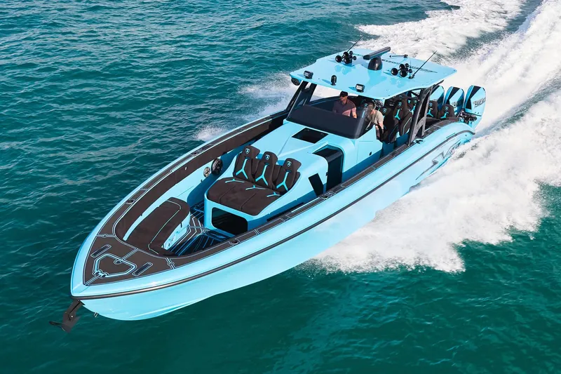 Slide: The Image of 2024 Midnight Express 43' Solstice speedboat cruising on clear blue water. - 1