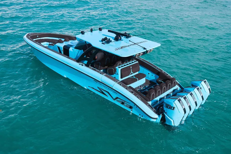 Slide: The Image of 2024 Midnight Express 43' Solstice boat on turquoise water, featuring sleek design and powerful engines. - 10