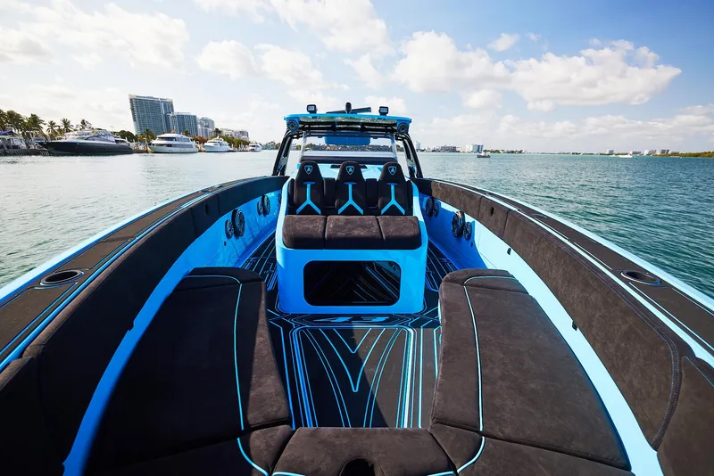 Slide: The Image of 2024 Midnight Express 43' Solstice luxury boat on calm water, featuring sleek design and vibrant colors. - 12