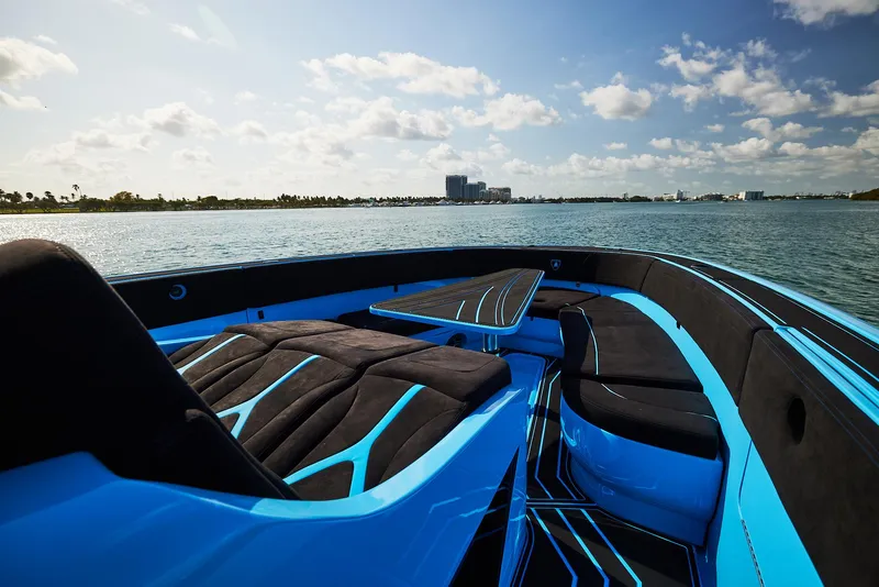 Slide: The Image of 2024 Midnight Express 43' Solstice boat on calm water, featuring sleek blue and black design. - 16