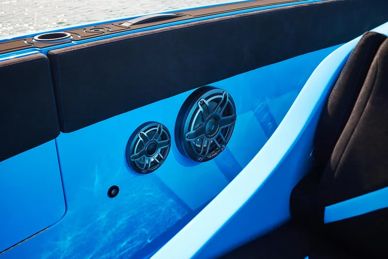 Slide: The Image of 2024 Midnight Express 43' Solstice boat interior with sleek blue panel and speakers. - 17