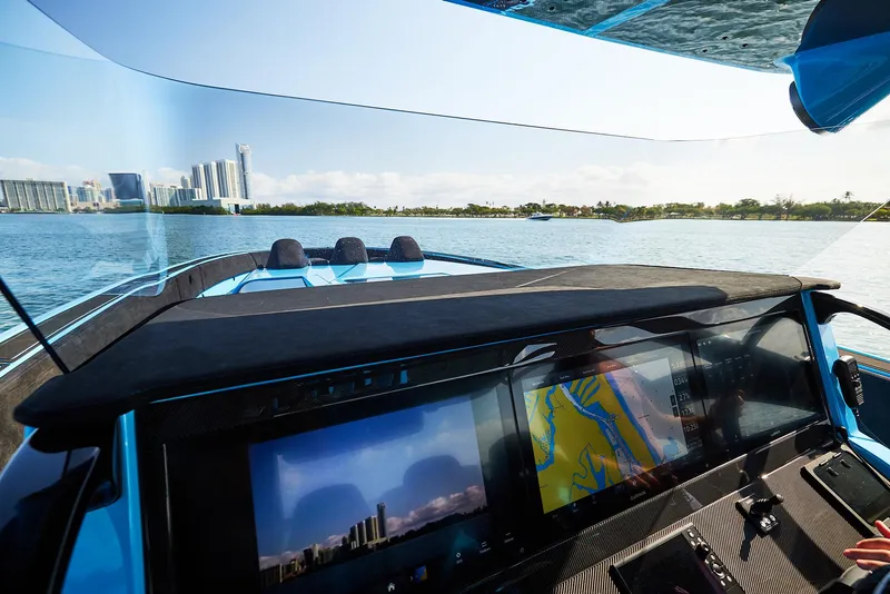 Slide: The Image of Interior view of 2024 Midnight Express 43' Solstice boat with navigation screens. - 19