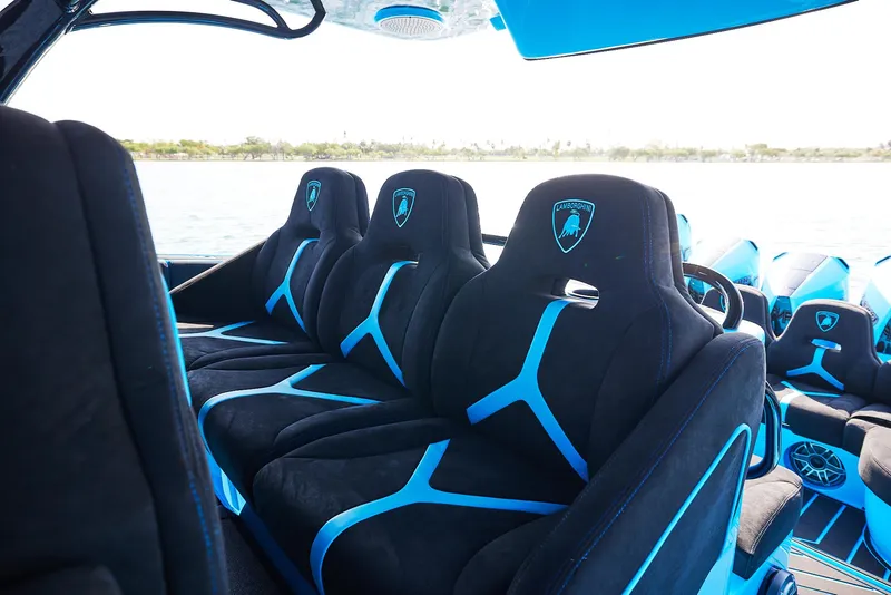 Slide: The Image of Luxurious interior of 2024 Midnight Express 43' Solstice boat with sleek black and blue seating. - 21