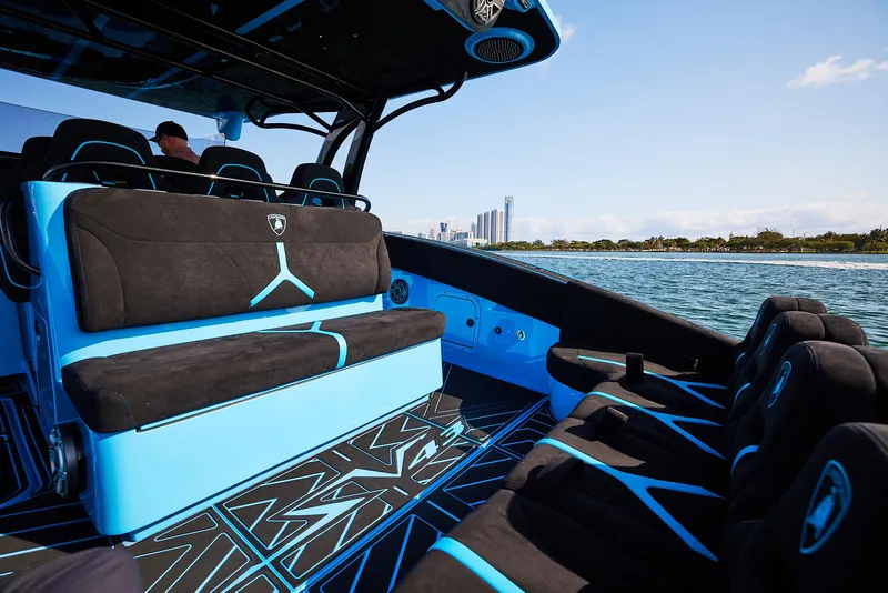 Slide: The Image of 2024 Midnight Express 43' Solstice luxury boat interior with modern seating and ocean view. - 23