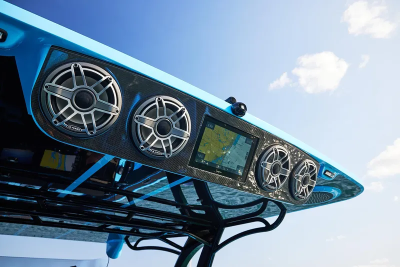 Slide: The Image of Midnight Express 43' Solstice 2024 boat speakers and navigation system under blue sky. - 24