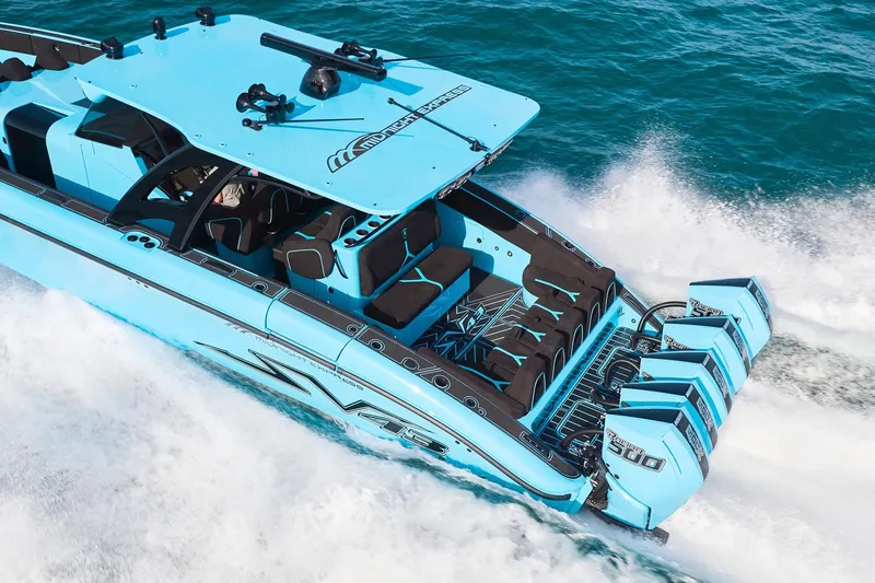Slide: The Image of 2024 Midnight Express 43' Solstice speedboat cruising on ocean waves. - 5