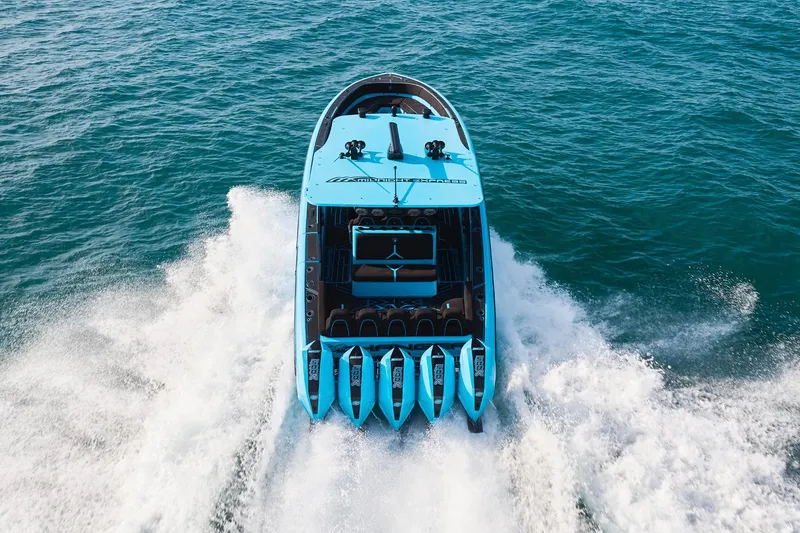 Slide: The Image of 2024 Midnight Express 43' Solstice speedboat cruising on open water. - 6
