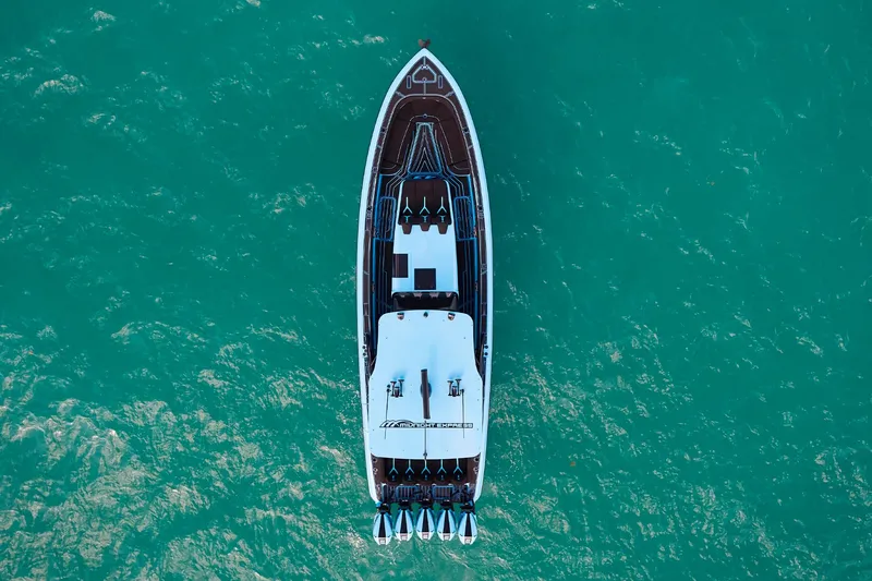 Slide: The Image of Aerial view of 2024 Midnight Express 43' Solstice yacht on turquoise water. - 7