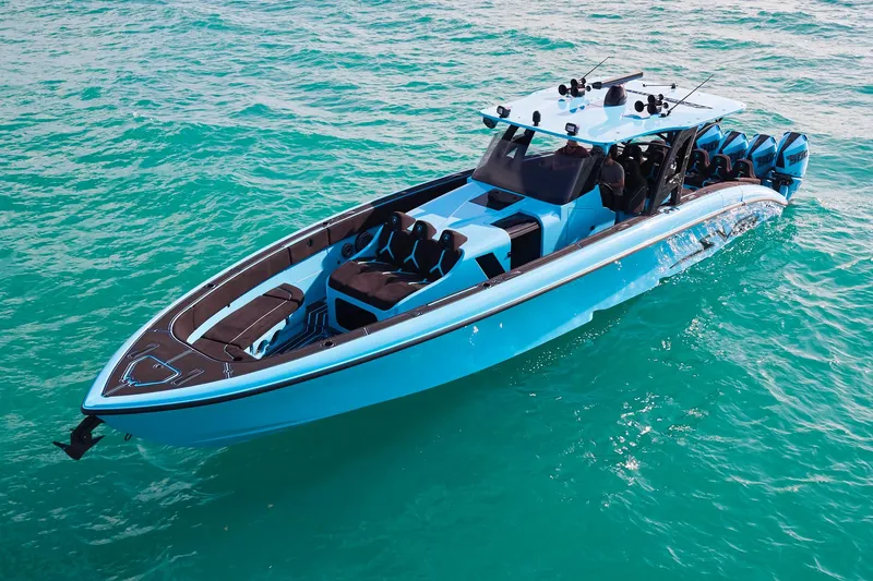 Slide: The Image of 2024 Midnight Express 43' Solstice boat on turquoise water, showcasing sleek design and luxury features. - 8
