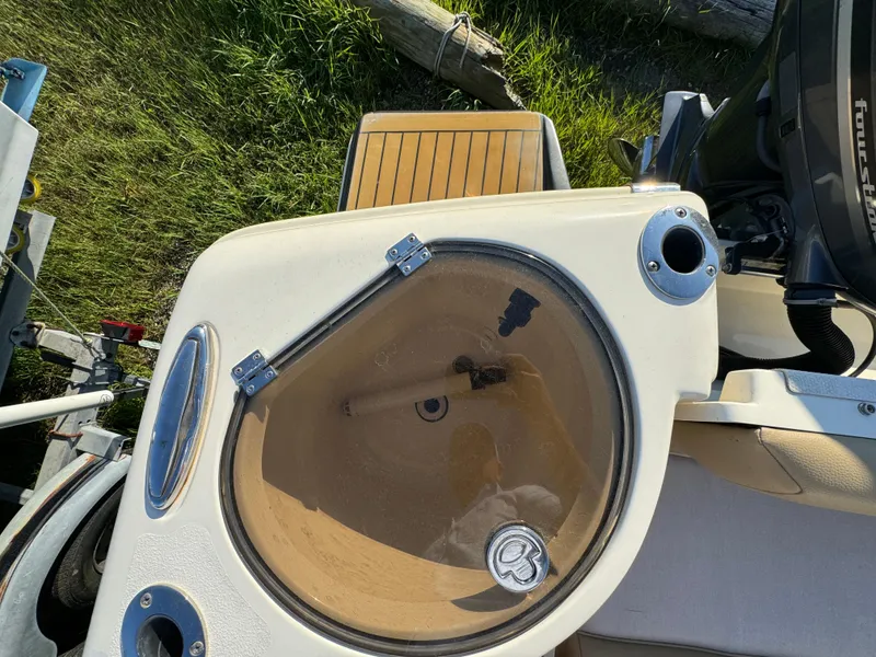 Slide: The Image of 2014 Scout 245 XSF boat with livewell and seating area, viewed from above. - 15