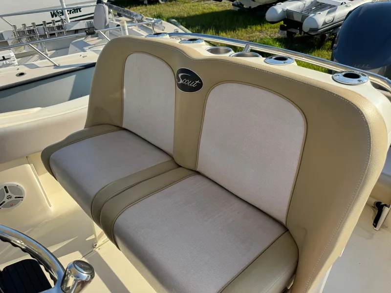 Slide: The Image of 2014 Scout 245 XSF boat seating with beige and white upholstery. - 22