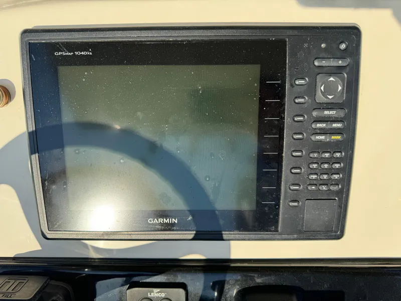 Slide: The Image of Garmin GPS display on 2014 Scout 245 XSF boat dashboard. - 25