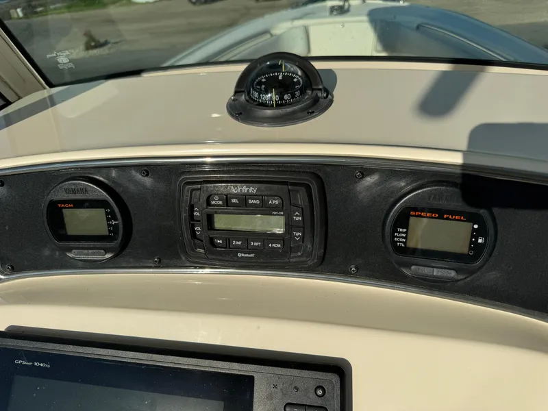 Slide: The Image of Dashboard of 2014 Scout 245 XSF boat with navigation instruments. - 26