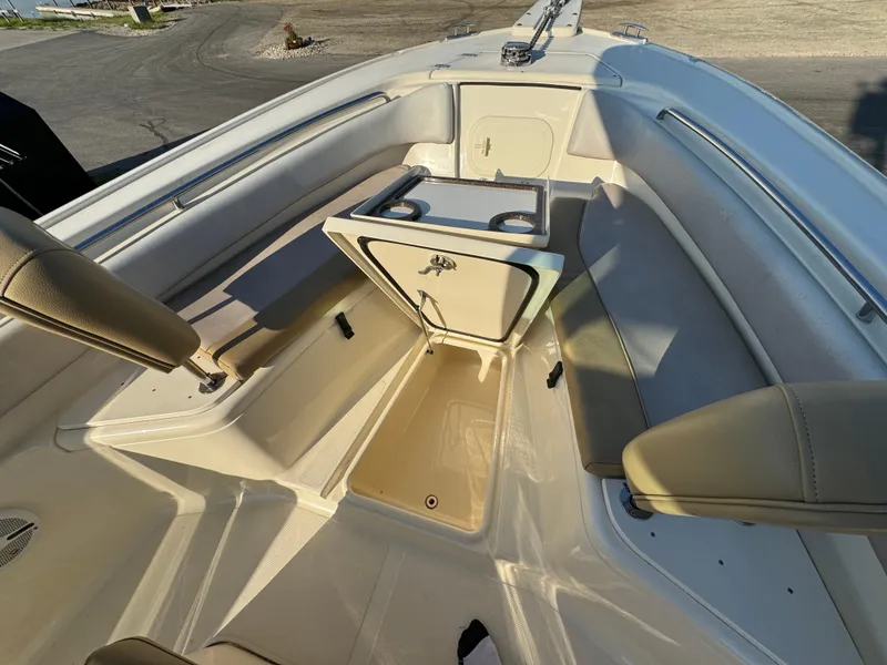 Slide: The Image of 2014 Scout 245 XSF boat interior with seating and storage compartments. - 40