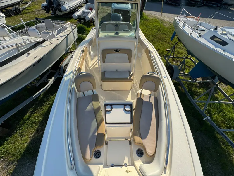 Slide: The Image of 2014 Scout 245 XSF boat interior with seating and storage compartments. - 48
