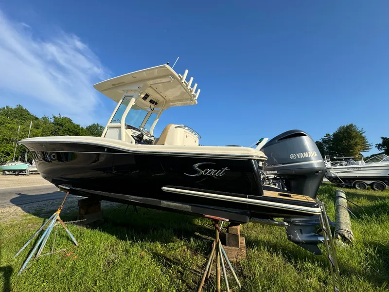 Slide: The Image of 2014 Scout 245 XSF boat with Yamaha engine on display outdoors. - 6