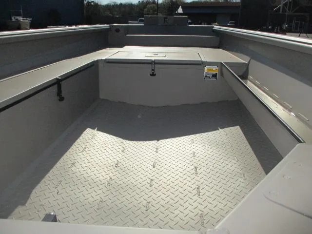 Slide: The Image of 2025 Reaper Boats 653-1236 interior with diamond-patterned flooring and storage compartments. - 3