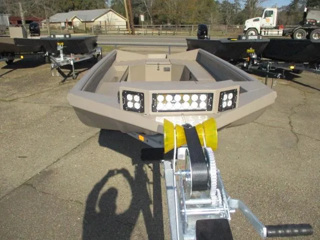 Slide: The Image of 2025 Reaper Boats 653-1236 on trailer, featuring LED lights, parked outdoors. - 5