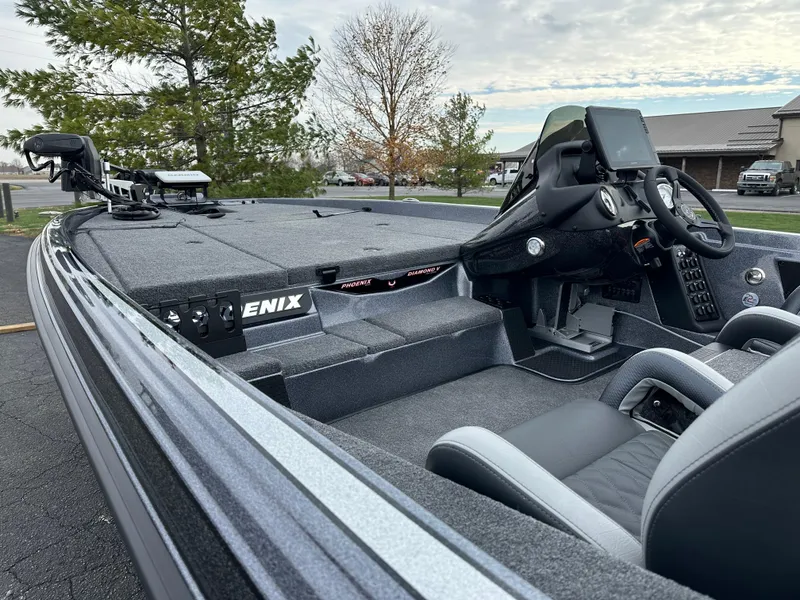 Slide: The Image of 2025 Phoenix 721 ZXL boat interior with steering console and seating. - 11