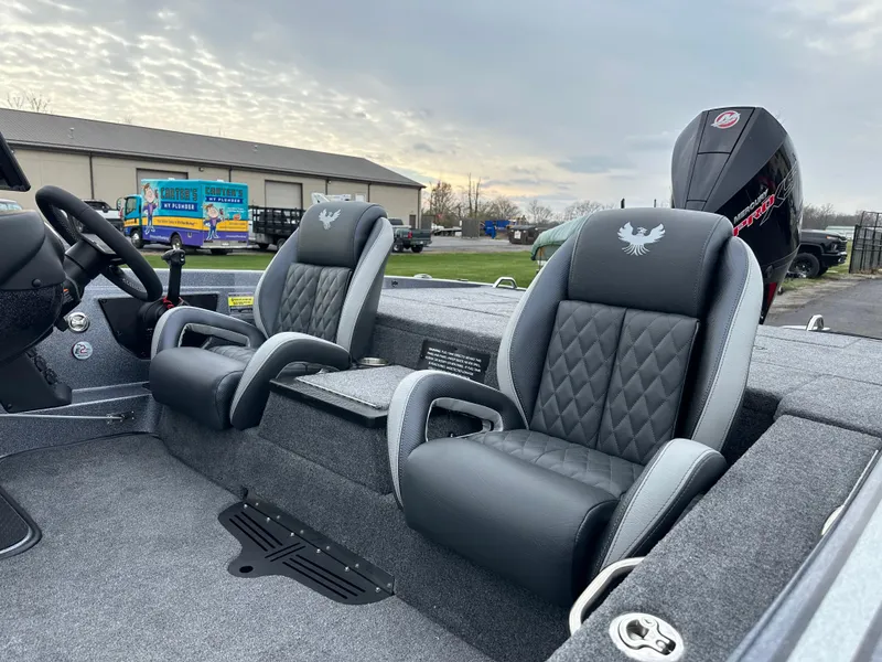 Slide: The Image of 2025 Phoenix 721 ZXL boat interior with plush seating and modern design. - 12
