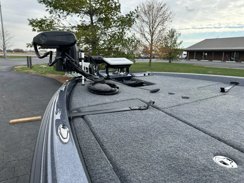 Slide: The Image of 2025 Phoenix 721 ZXL boat deck with advanced fishing equipment. - 13