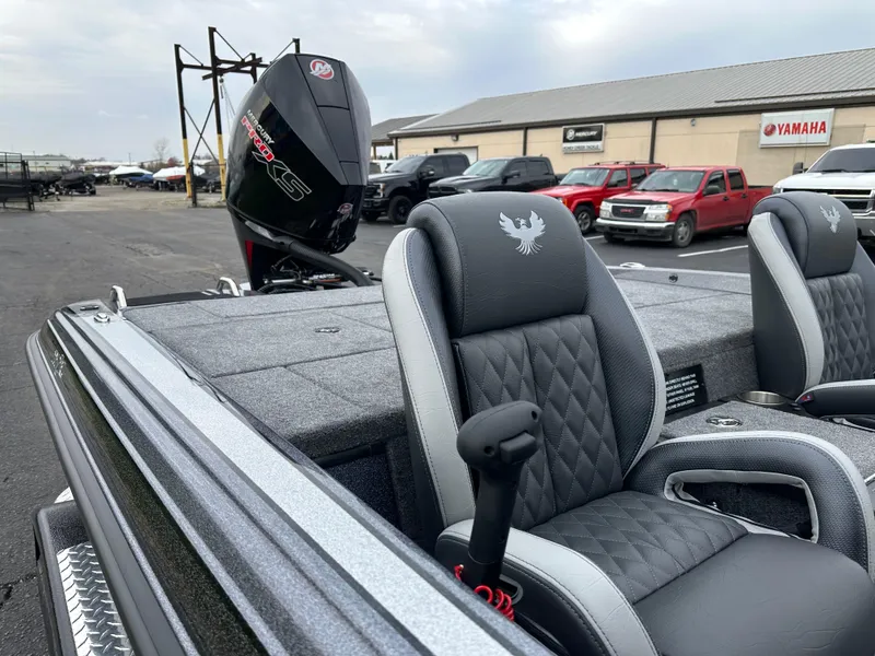 Slide: The Image of 2025 Phoenix 721 ZXL boat with sleek seating and powerful outboard motor. - 16