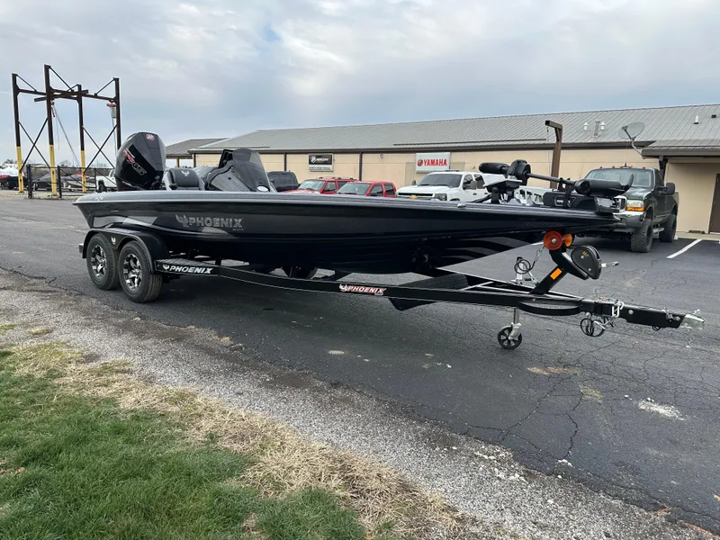 Slide: The Image of 2025 Phoenix 721 ZXL boat on trailer in parking lot, overcast sky. - 4